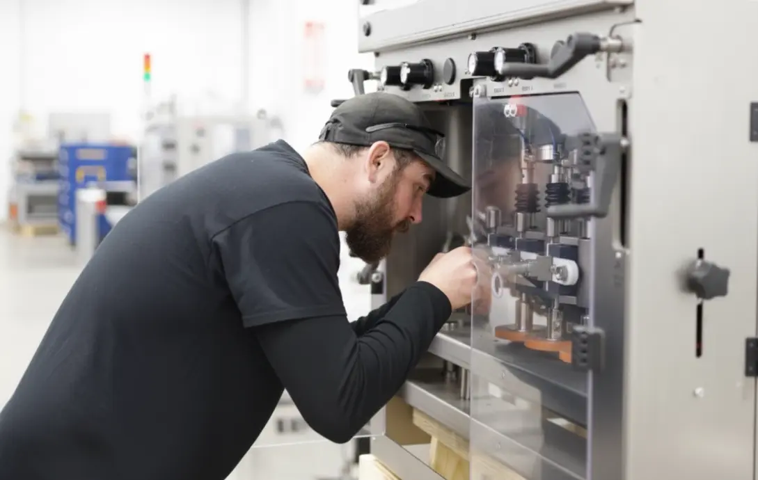 SIGMA technician performing on-site repairs